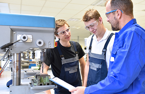 students being trained on machine